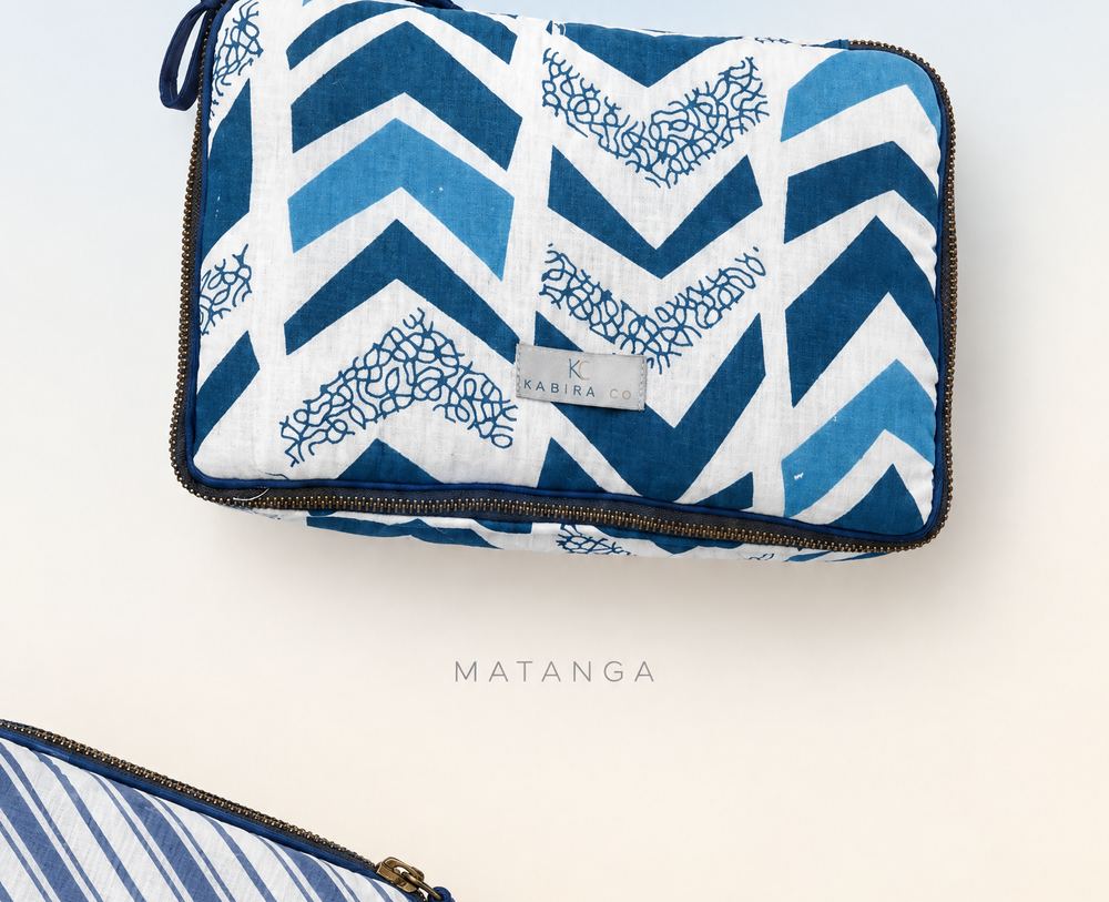Quilted cotton travel pouch in an indigo chevron print
