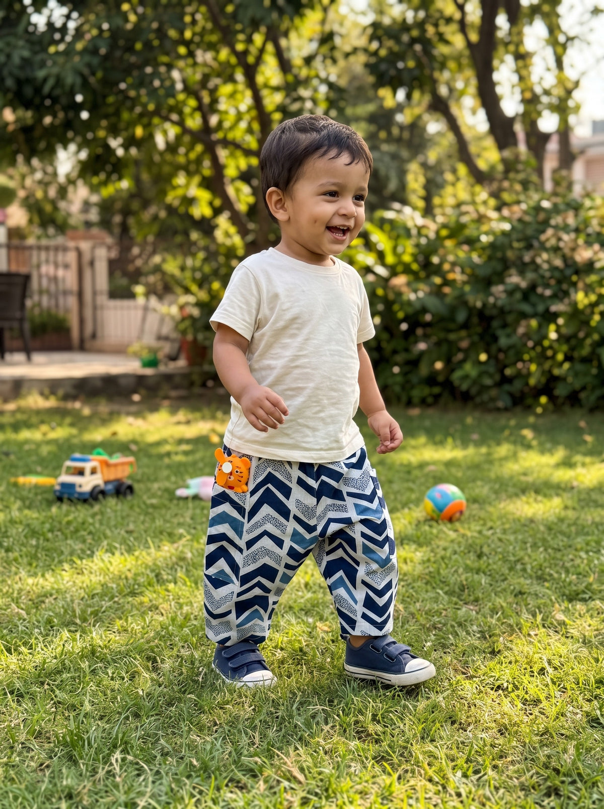 Toddler walking in the Indigo Chevron cotton pants (styled image)