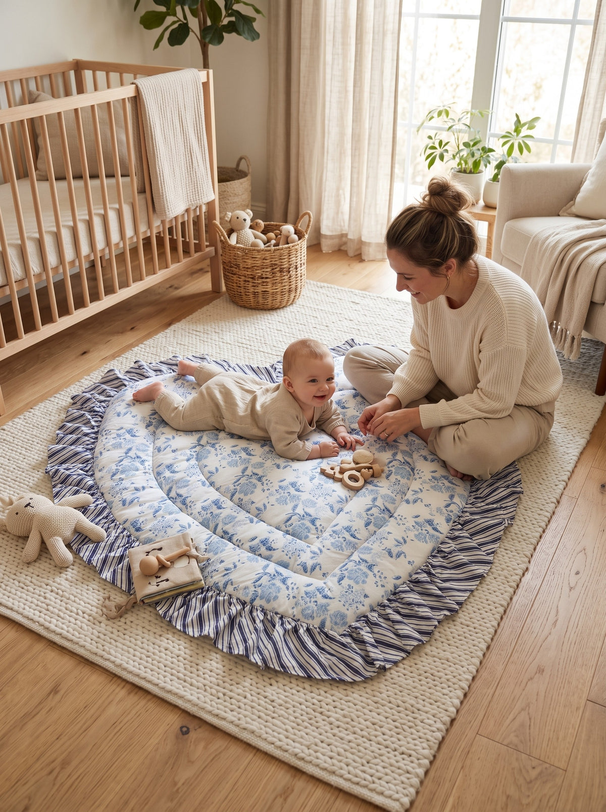 Parent and baby on the Blue Floral heart play mat (styled image)