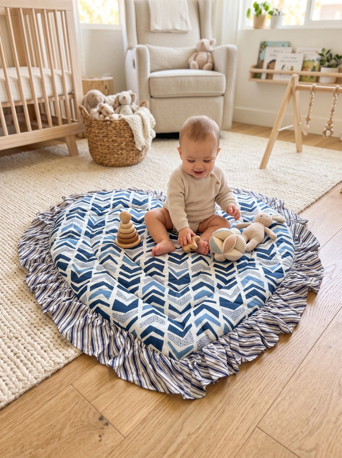 Baby sitting on the Indigo Chevron heart play mat (styled image)