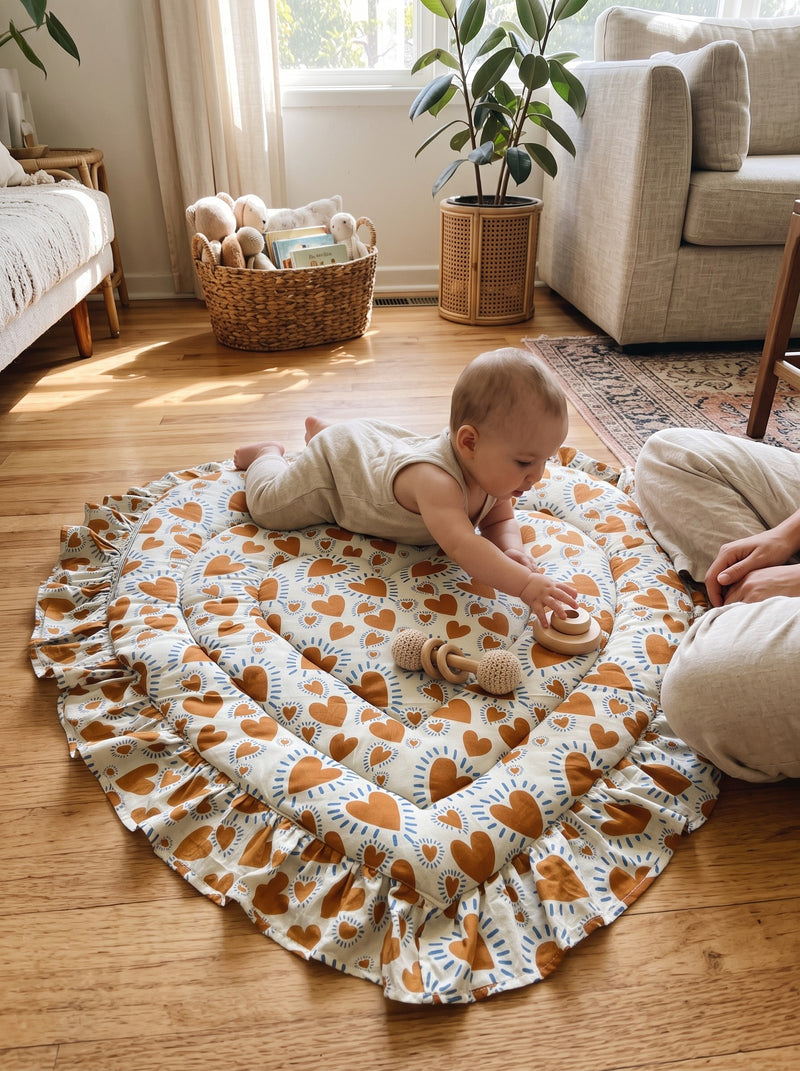 Baby on the Rust Heart heart play mat (styled image)