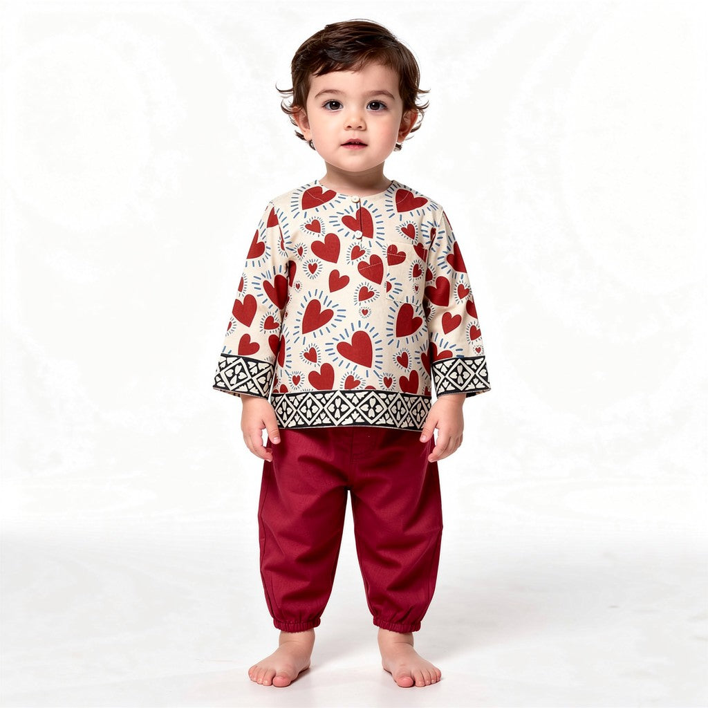 Red Heart kurta set on a toddler, white background (styled image)