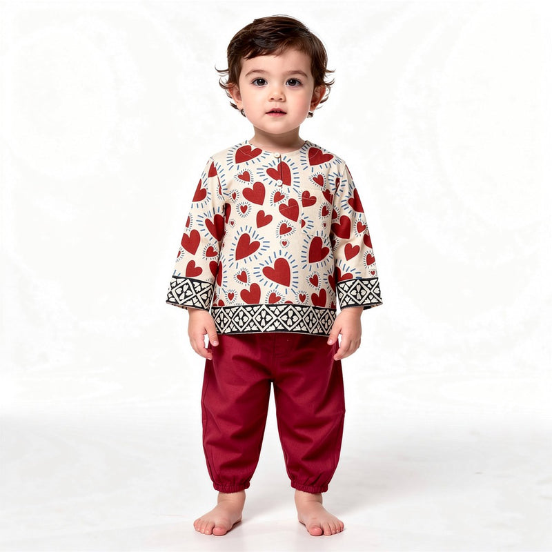 Red Heart kurta set on a toddler, white background (styled image)
